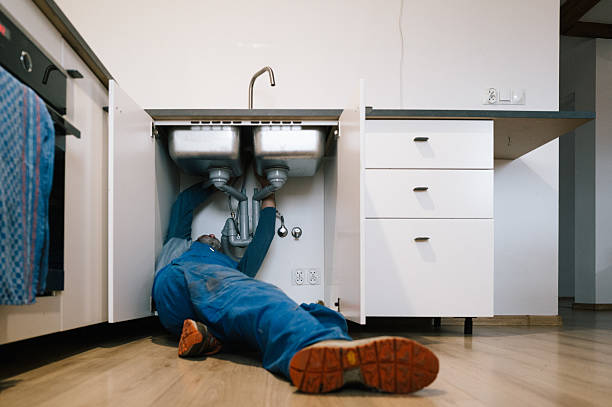 Professional Emergency Plumber technician working in Upton, MA